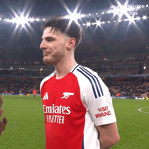 A Man Wearing A Red And White Emirates Fly Better Shirt GIF