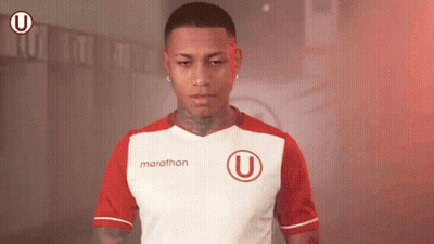 A Man Wearing A Red And White Marathon Shirt GIF