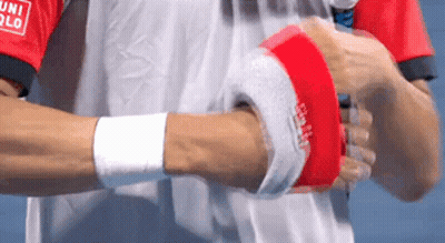 A Man Wearing A Red And White Shirt That Says Uniqlo On The Sleeve GIF