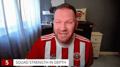 A Man Wearing A Red And White Striped Adidas Shirt Is Smiling GIF