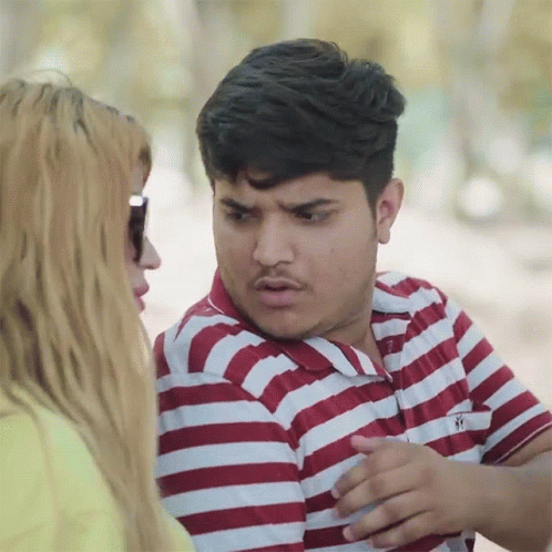 A Man Wearing A Red And White Striped Shirt Has The Letter S On The Front Of His Shirt GIF