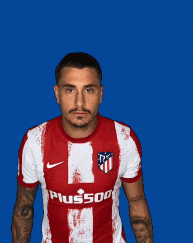 A Man Wearing A Red And White Striped Shirt With A Hyundai Logo On It GIF
