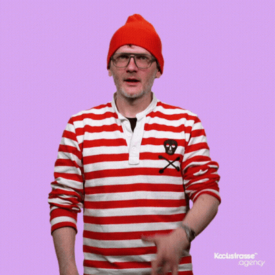 A Man Wearing A Red And White Striped Shirt With A Skull And Crossbones On The Chest GIF