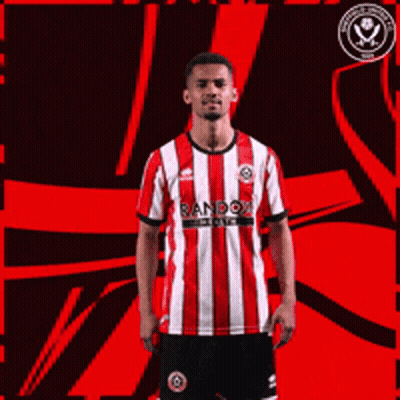 A Man Wearing A Red And White Striped Shirt With Random Written On It Giving A Thumbs Up GIF