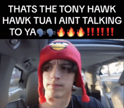 A Man Wearing A Red Angry Bird Hat Is In A Car GIF