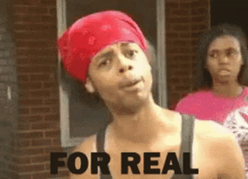 A Man Wearing A Red Bandana Says " For Real " In Front Of A Brick Building GIF