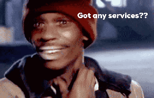 A Man Wearing A Red Beanie Is Smiling And Says Got Any Services GIF
