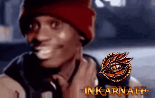 A Man Wearing A Red Beanie Is Smiling Next To A Logo That Says Inkarnate GIF