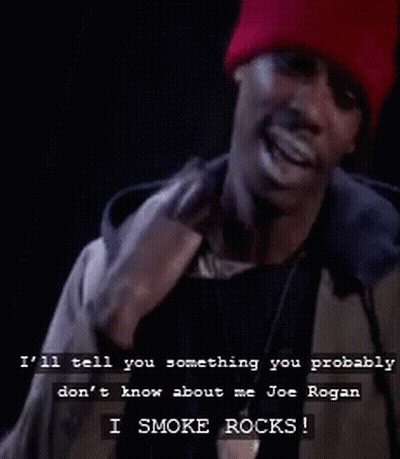 A Man Wearing A Red Beanie Is Smoking A Cigarette And Says I Smoke Rocks GIF
