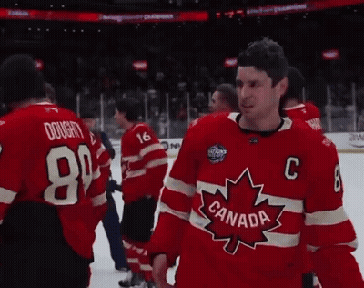 A Man Wearing A Red Canada Jersey Stands On The Ice GIF