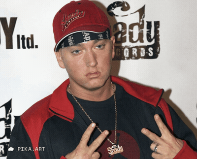 A Man Wearing A Red Hat And A Bandana Stands In Front Of A Sign That Says Edu Records GIF