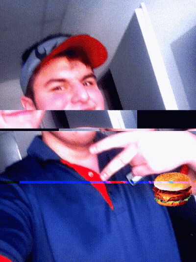 A Man Wearing A Red Hat And A Blue Shirt Holds A Hamburger GIF