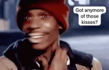 A Man Wearing A Red Hat And A Jacket Is Smiling And Talking On A Cell Phone . GIF