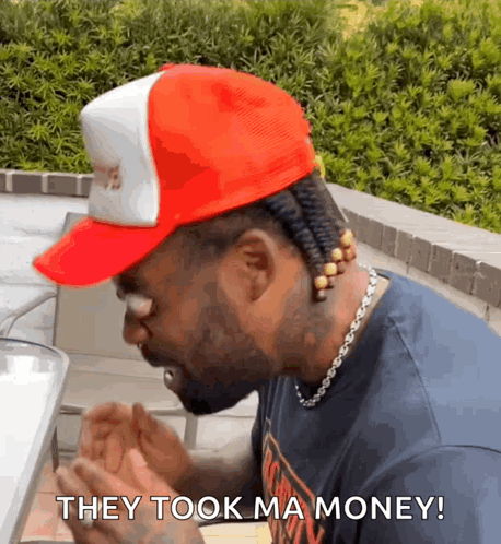 A Man Wearing A Red Hat And A Necklace Says " They Took Ma Money " GIF