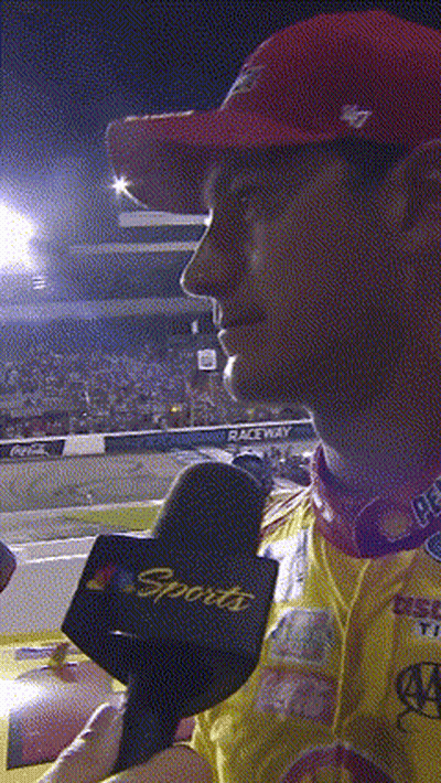 A Man Wearing A Red Hat And A Sports Microphone GIF