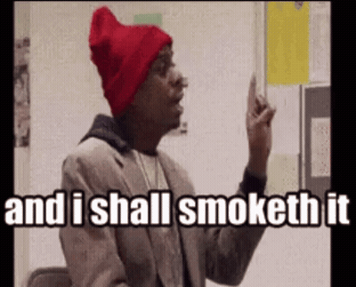 A Man Wearing A Red Hat And A Suit Says And I Shall Smoke It GIF