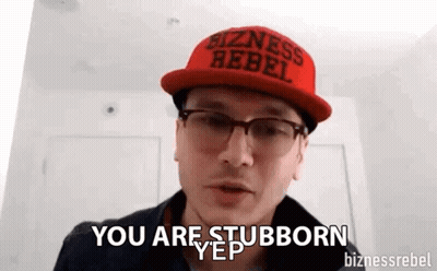 A Man Wearing A Red Hat And Glasses Says `` You Are Stubborn '' . GIF
