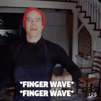 A Man Wearing A Red Hat And Overalls Says " Finger Wave " GIF