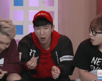 A Man Wearing A Red Hat Has The Number 27 On His Sweatshirt GIF