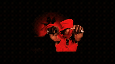 A Man Wearing A Red Hat Is Dancing With Another Man GIF