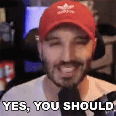 A Man Wearing A Red Hat Is Smiling And Saying Yes You Should . GIF