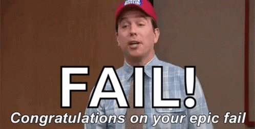 A Man Wearing A Red Hat Is Standing In Front Of A Sign That Says Fail ! GIF