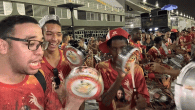 A Man Wearing A Red Hat That Says Rio De Janeiro GIF