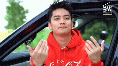 A Man Wearing A Red Hoodie That Says Coca Cola On It GIF