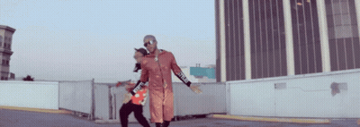 A Man Wearing A Red Jacket With The Word Supreme On The Sleeves GIF