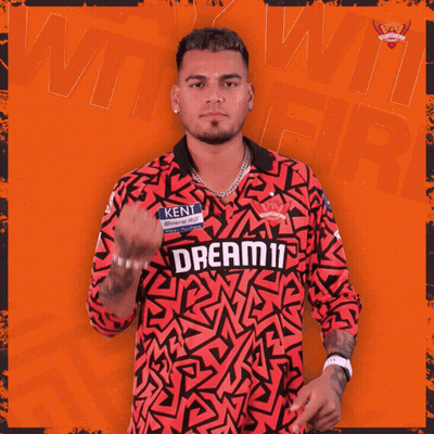 A Man Wearing A Red Jersey That Says Dream11 GIF