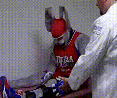 a man wearing a red jersey that says philadelphia on it