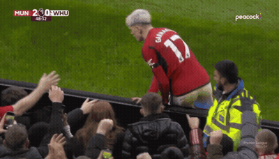 A Man Wearing A Red Jersey With The Number 17 On The Back GIF