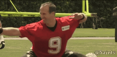 A Man Wearing A Red Jersey With The Number 9 On It Is On A Football Field GIF