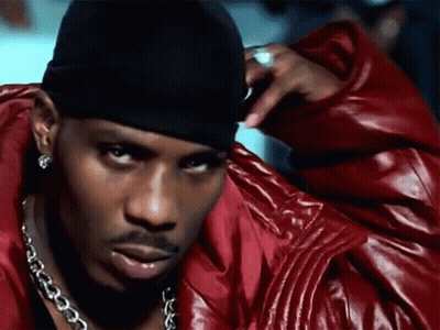 A Man Wearing A Red Leather Jacket And A Black Headband GIF