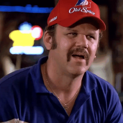 A Man Wearing A Red Old Spice Hat GIF
