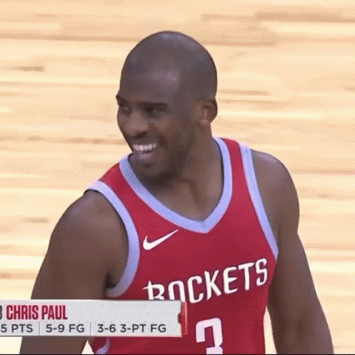 A Man Wearing A Red Rockets Jersey Smiles GIF
