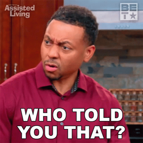 A Man Wearing A Red Shirt Is Asking Who Told You That GIF