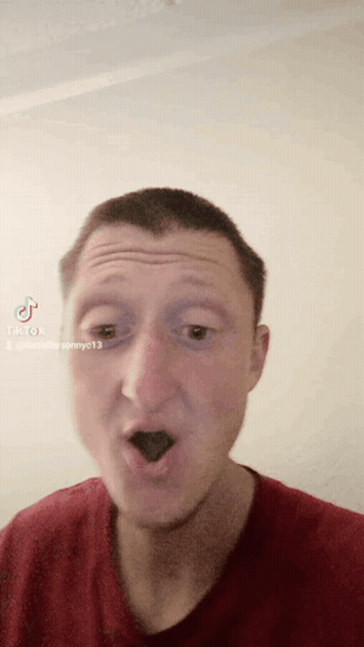 A Man Wearing A Red Shirt Is Making A Funny Face With Tiktok Written On The Bottom Right GIF