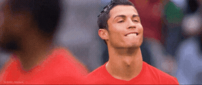 A Man Wearing A Red Shirt Is Smiling And Looking Up GIF