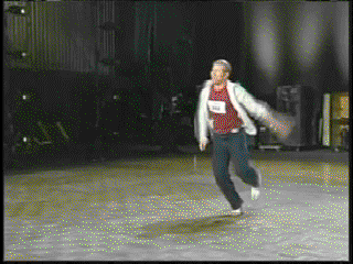 A Man Wearing A Red Shirt That Says ' A ' On It Is Running GIF
