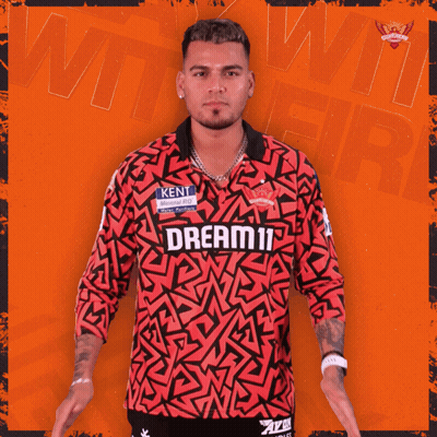 A Man Wearing A Red Shirt That Says Dream11 GIF