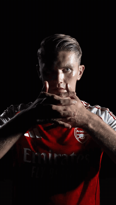 A Man Wearing A Red Shirt That Says Emirates GIF