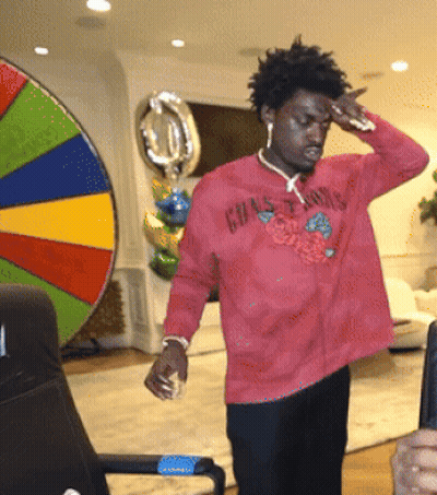 A Man Wearing A Red Shirt That Says Grasshoppers On It GIF