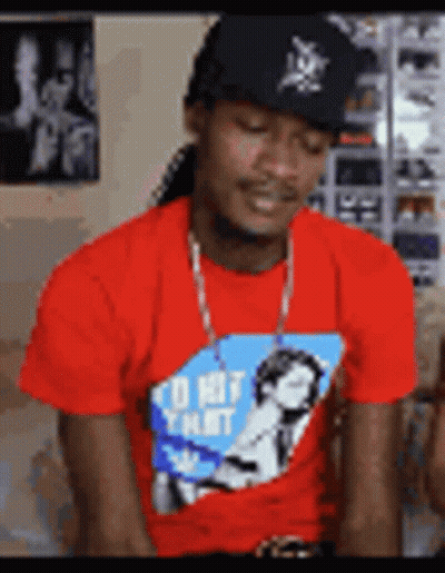 A Man Wearing A Red Shirt That Says I 'D Hit That On It GIF