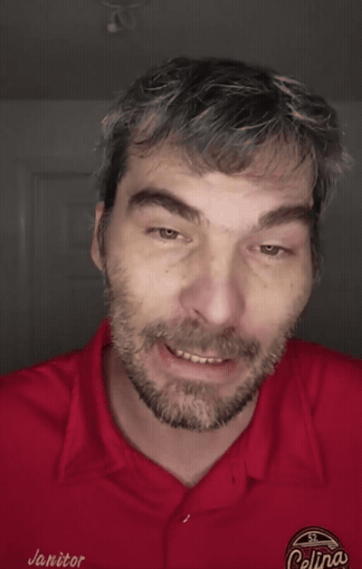 A Man Wearing A Red Shirt That Says " I Didn 'T Care " GIF