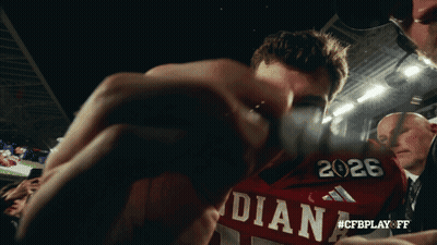 A Man Wearing A Red Shirt That Says Indiana GIF