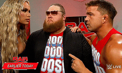 A Man Wearing A Red Shirt That Says No Duo Dos Is Standing Next To Two Other Men GIF