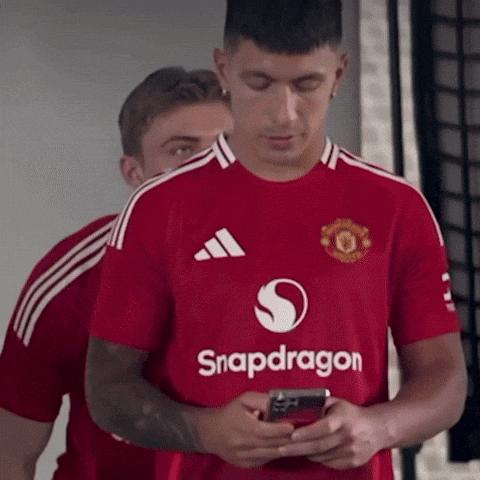 A Man Wearing A Red Shirt That Says Snapdragon On It GIF