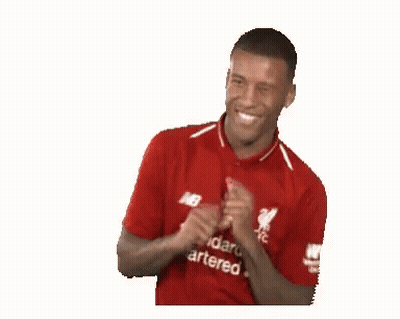 A Man Wearing A Red Shirt That Says Standard Chartered On It Is Smiling . GIF
