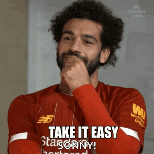 A Man Wearing A Red Shirt That Says Take It Easy On It GIF
